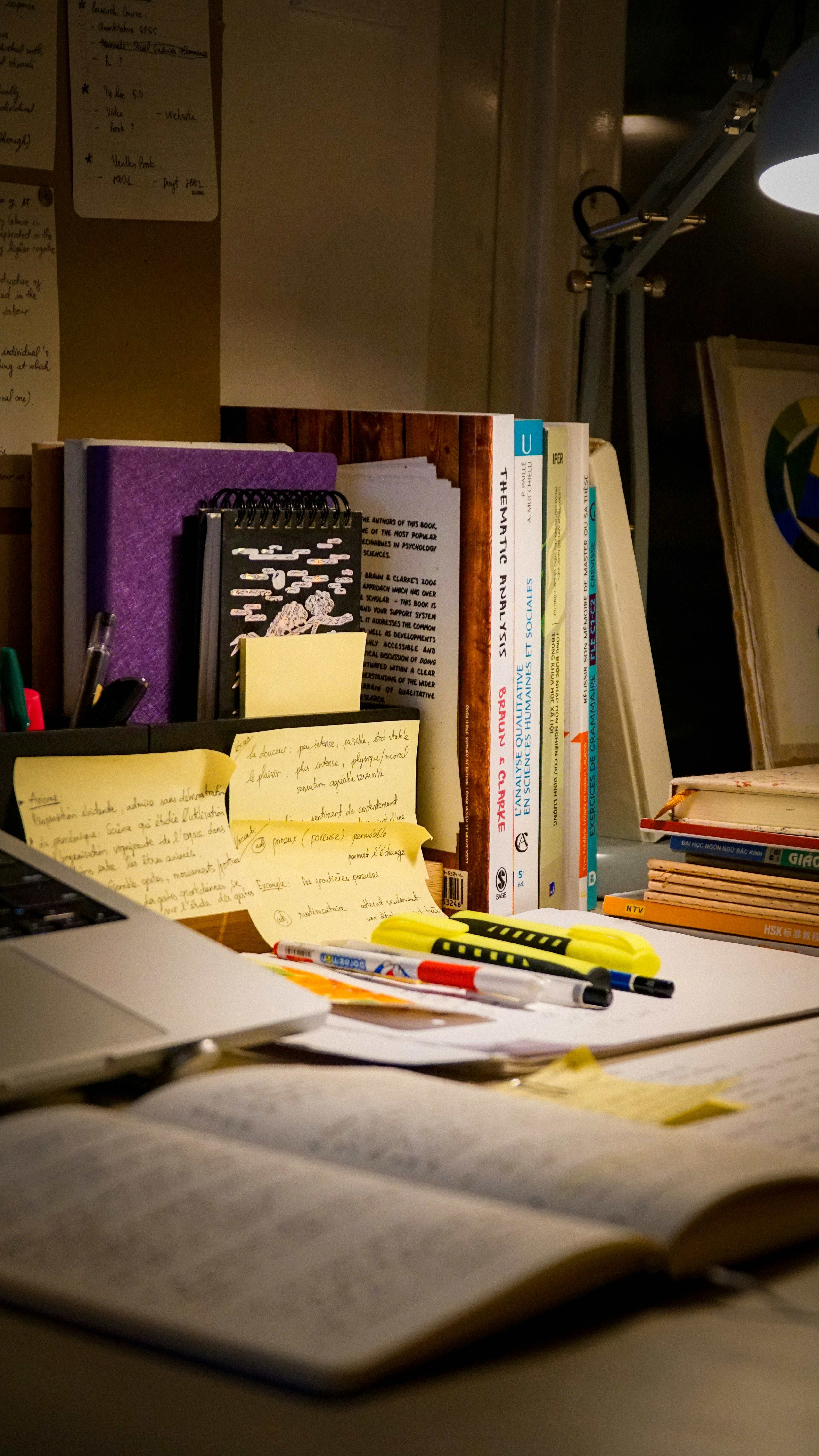 Student desk with books, notes and study materials